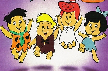 Four cheerful Flintstones kids-Bamm-Bamm, Pebbles, and two friends-jumping joyfully in colorful prehistoric outfits.