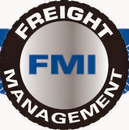FMI Freight Management logo with blue text on silver circular background and black border