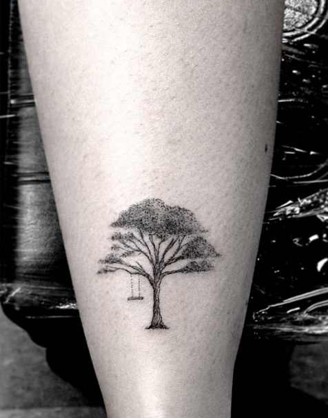 Tree tattoo on the left upper arm.