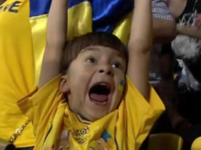 Joyful Ukrainian Fan Celebrating at International Sports Match