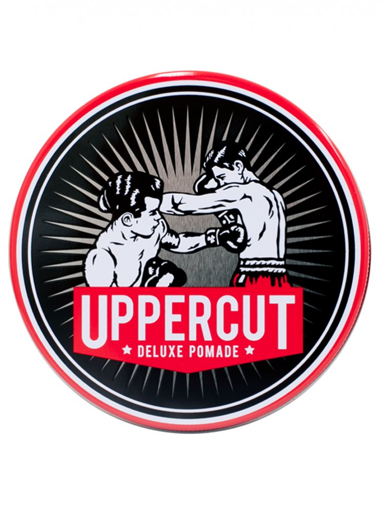 Uppercut Deluxe Pomade tin lid featuring vintage boxing illustration with bold red, black, and white design.