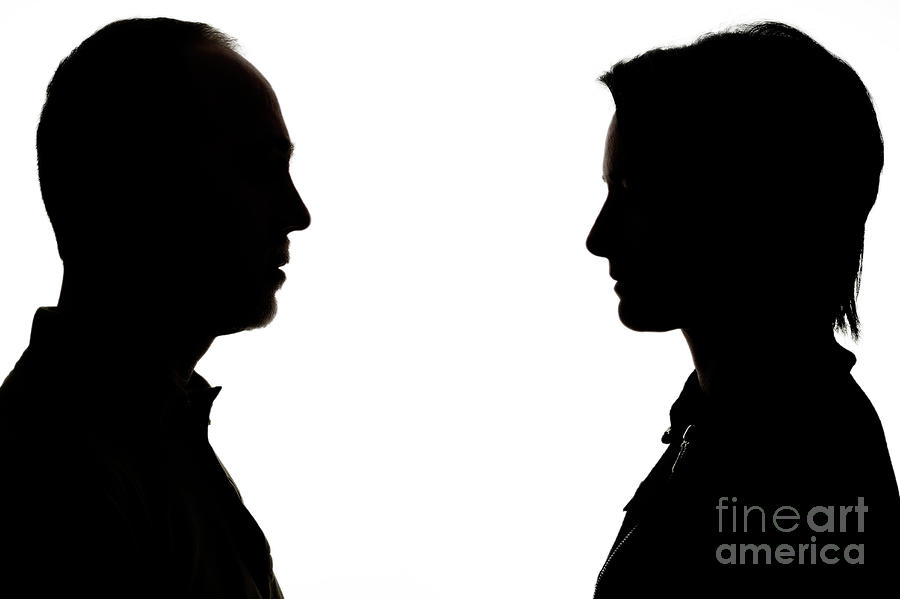 Silhouette Of Man And Woman Face To Face by Sami Sarkis