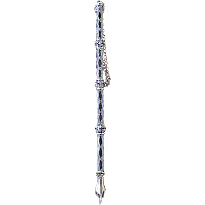 Ornate silver yad with black enamel inlays and decorative chain, used for Torah reading.