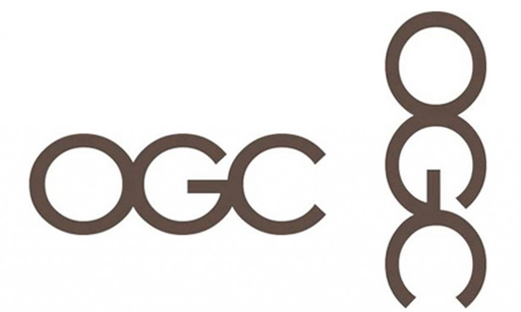 OGC logo featuring stylized brown letters "OGC" in horizontal and vertical orientations on white background.