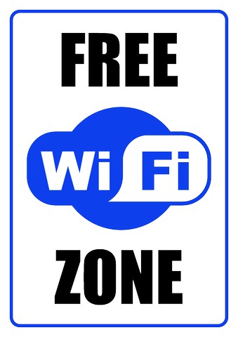 Blue and white "Free Wi-Fi Zone" sign with cloud icon and bold text.
