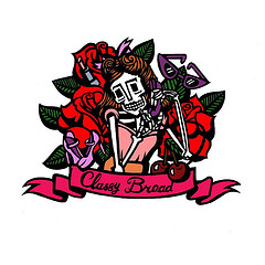 A stylized tattoo-style illustration of a skeleton in a suit holding a rose, surrounded by red roses and green leaves, with a banner reading "Classy Brood".