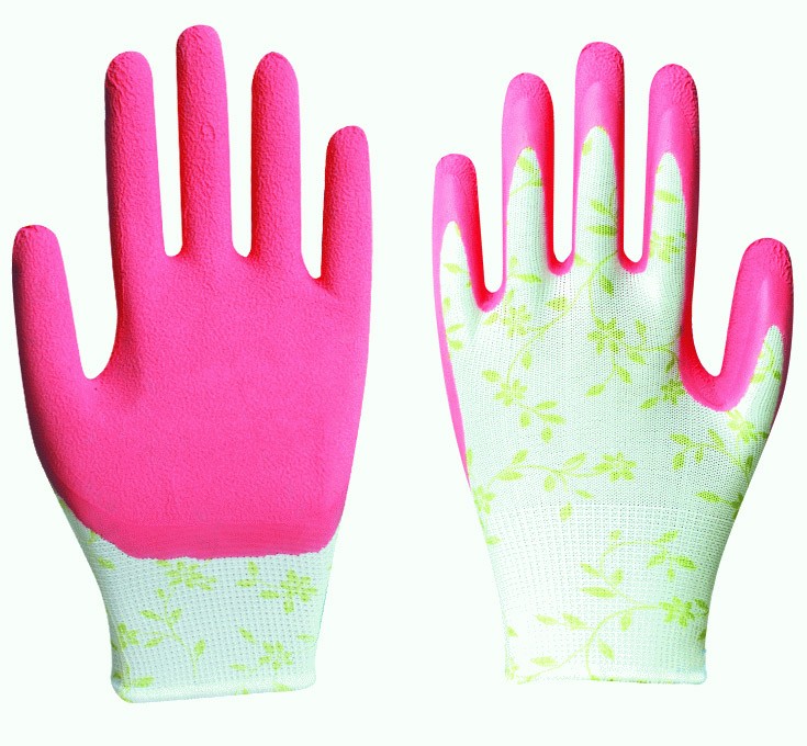 Pink-coated gardening gloves with floral-patterned fabric back and textured grip palm.