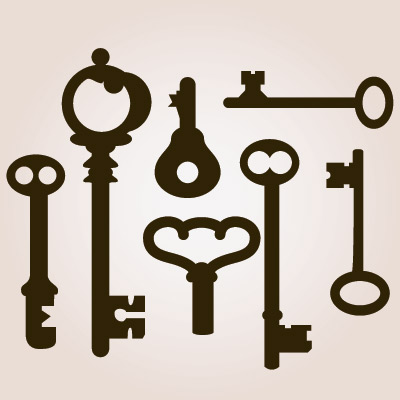 Collection of vintage skeleton keys in silhouette against beige background