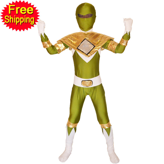 Child in green Power Ranger costume with gold accents, posing heroically against white background, 'Free Shipping' badge visible.