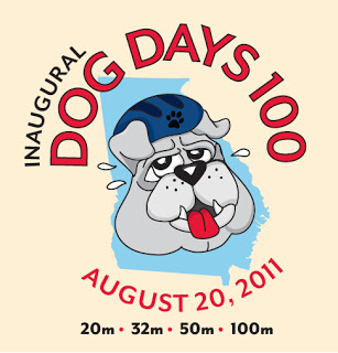 Inaugural Dog Days 100 event logo featuring a cartoon bulldog wearing a helmet, with race distances and date listed.