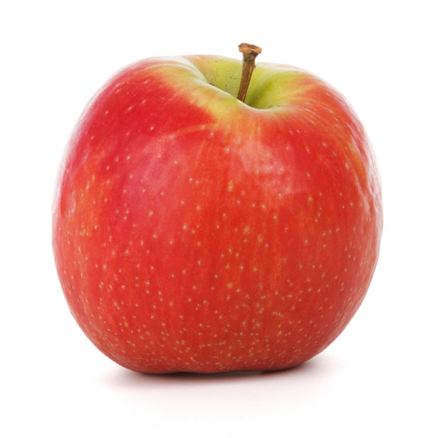 A fresh red apple with yellow-green blush and natural speckles, stem intact, on white background.