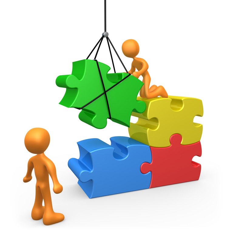 Two orange figures assembling colorful 3D puzzle pieces with a crane, symbolizing teamwork and problem-solving.