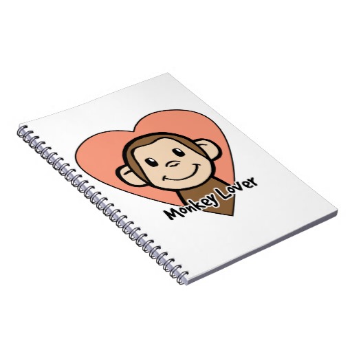 Spiral notebook with "Monkey Lover" design featuring a smiling cartoon monkey inside a peach heart.
