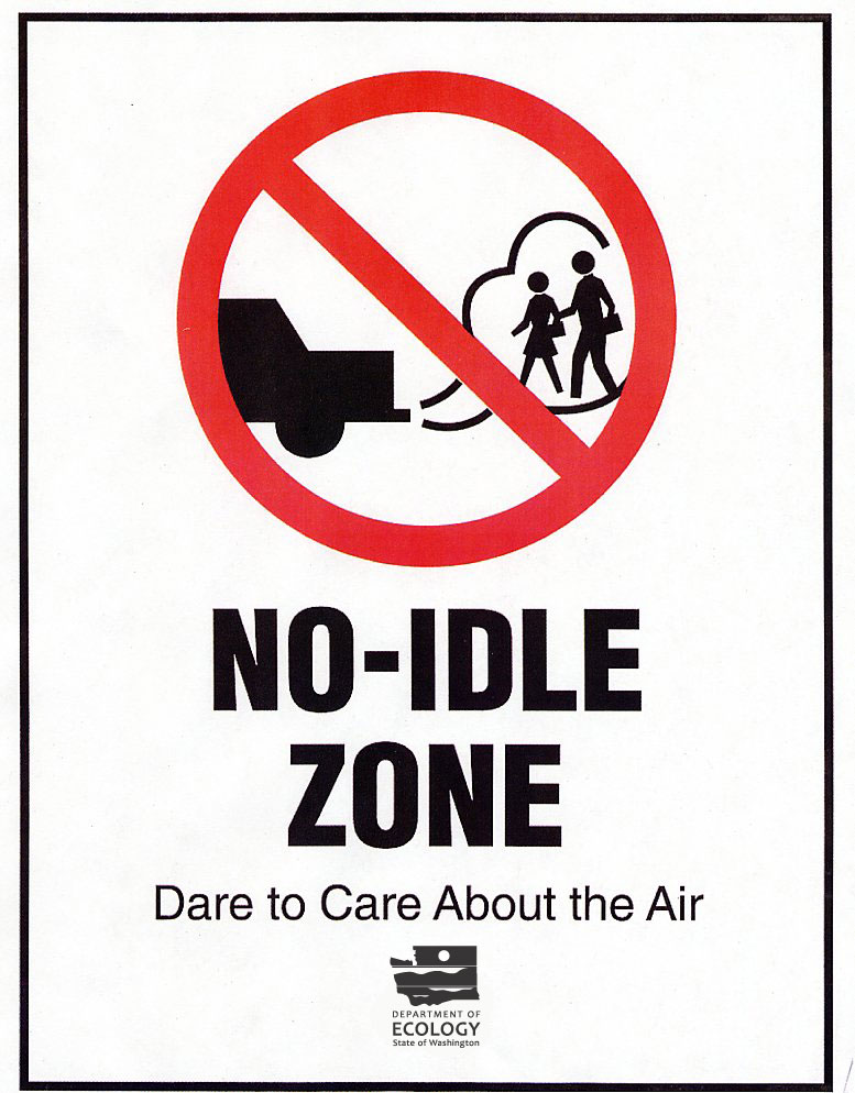 No-idle zone sign showing a vehicle emitting exhaust near pedestrians, with red prohibition symbol and "Dare to Care About the Air" slogan.