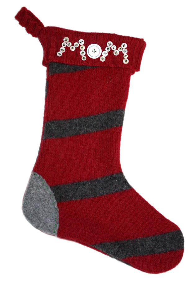 Red and gray striped knitted Christmas stocking with decorative buttons on cuff