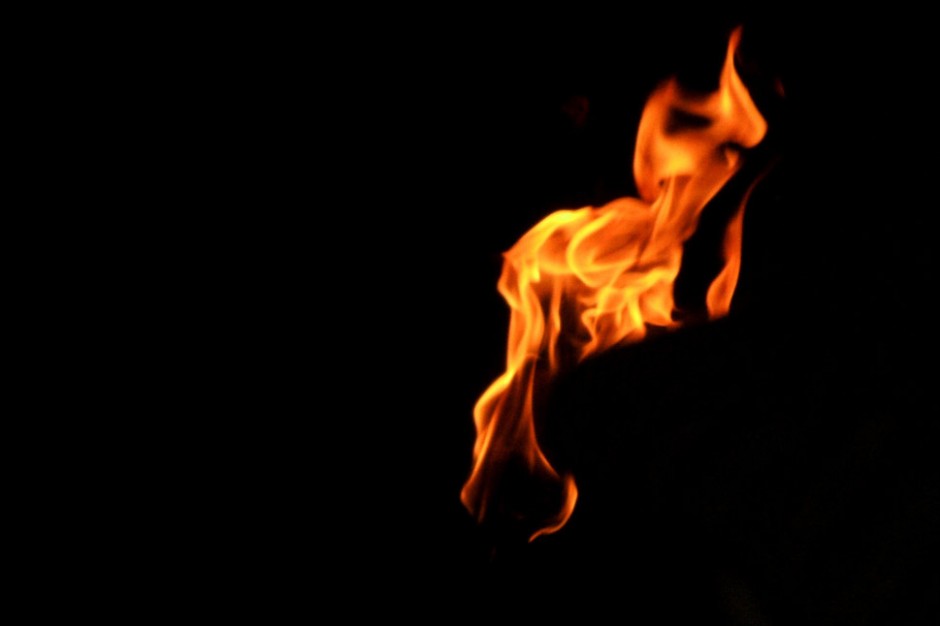 Fiery Flame on Black Background - High-Contrast Fire Imagery for Design & Media