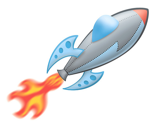 Cartoon-style silver rocket with blue fins and orange flame launching upward.