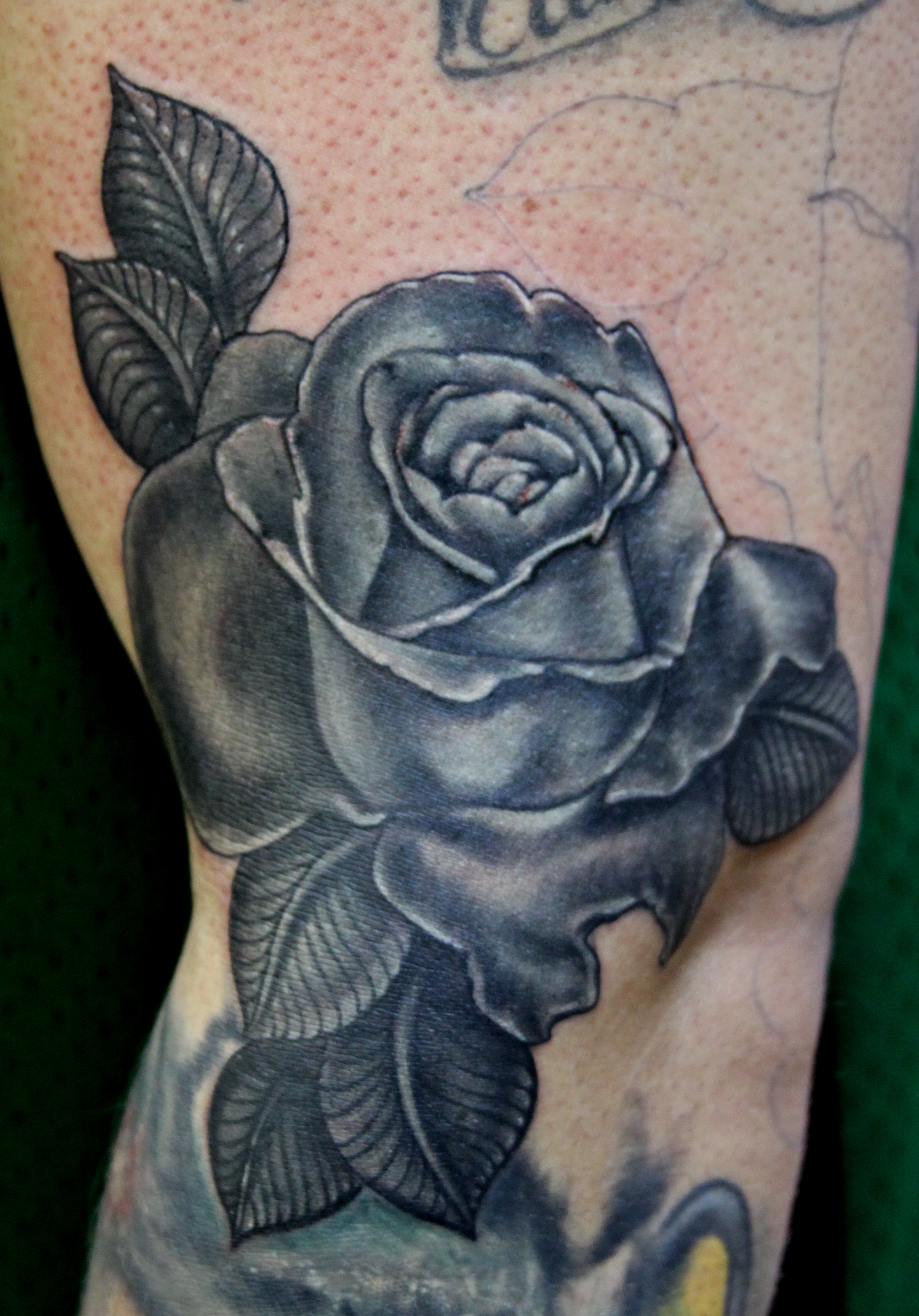 realistic rose tattoo done at Masterpiece Tattoo in San Francisco