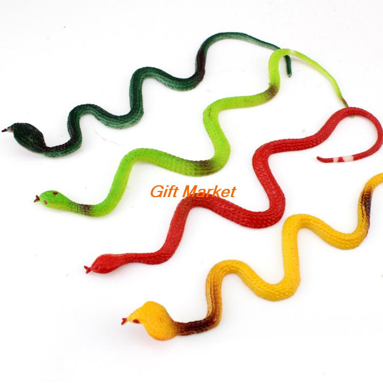 Five colorful plastic toy snakes in green, red, yellow, and gradient hues arranged on white background.