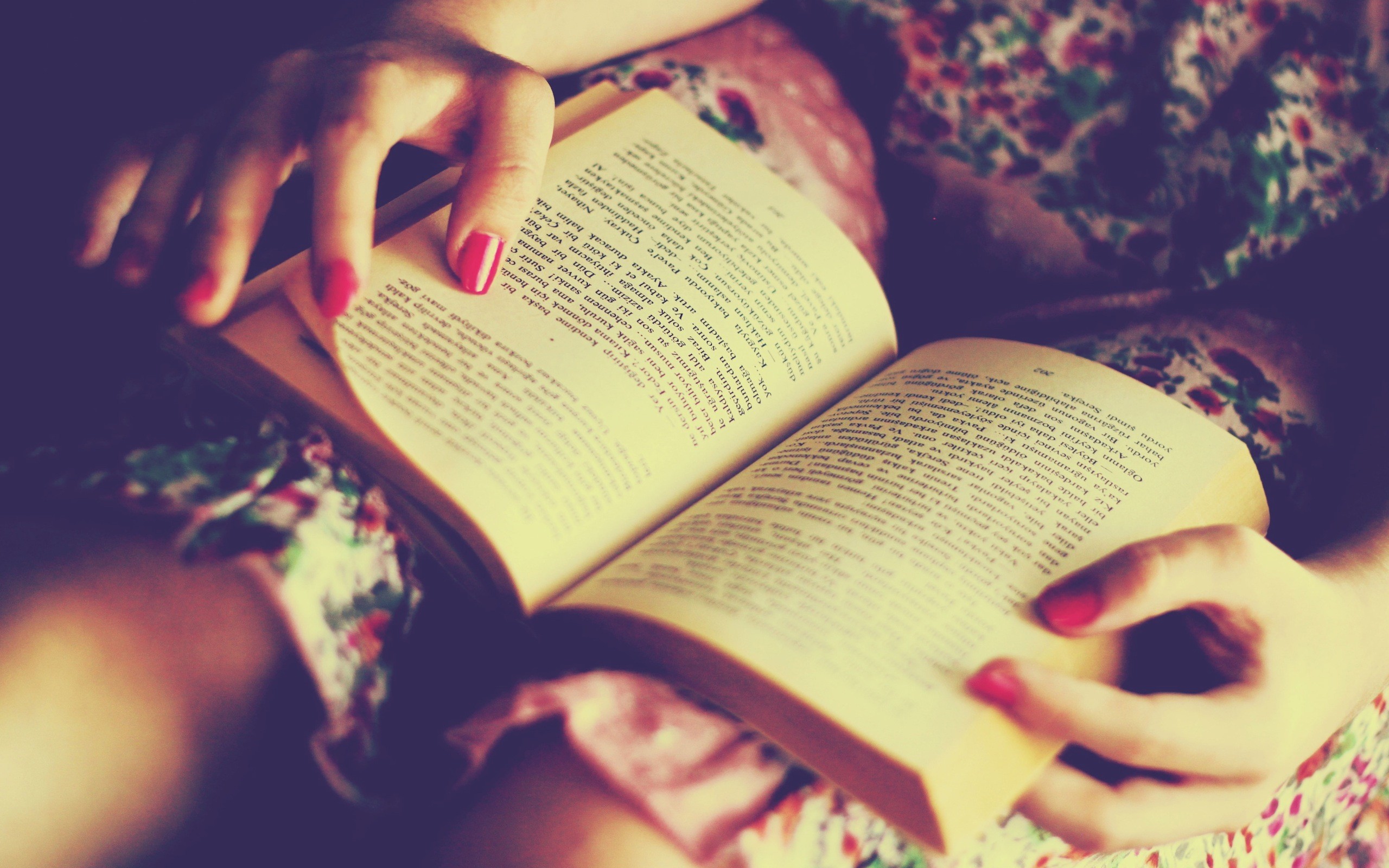 Cozy Reading Moment - Immersed in a Book on a Floral Blanket