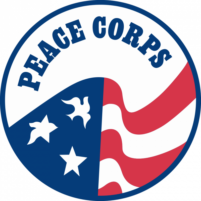 Official Peace Corps logo featuring patriotic red, white, and blue colors with stars, doves, and stripes in a circular emblem.