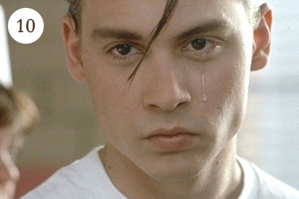 Johnny Depp with a tear rolling down his cheek, intense gaze, close-up portrait.
