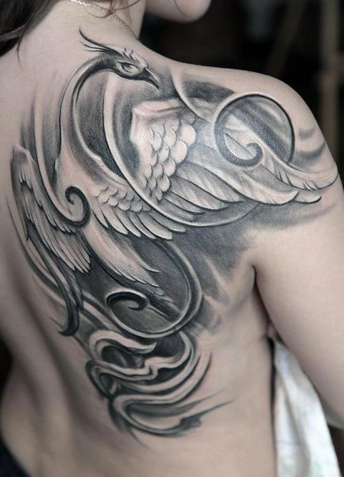 Black and white phoenix tattoo on back of girls shoulder | wings 