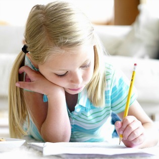 Child Studying Homework - Focused Learning Moment