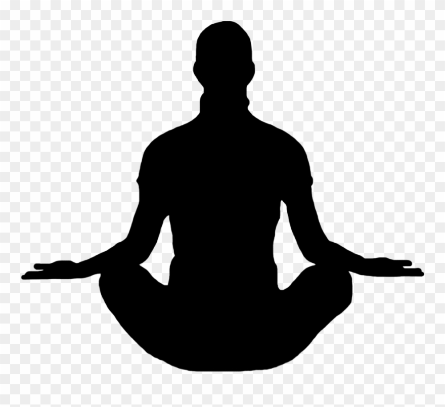 Silhouette of a person meditating in a lotus position