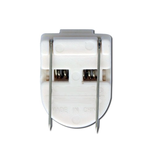 White plastic electrical connector with metal pins and spring contacts