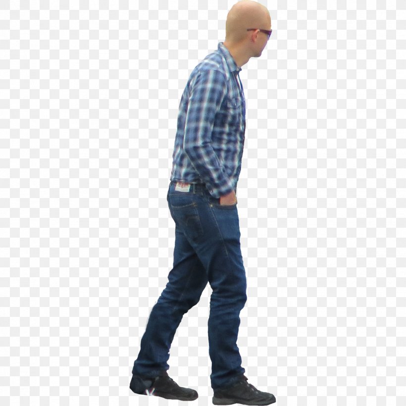 A bald man wearing a blue plaid shirt, jeans, and sunglasses, walking in profile.